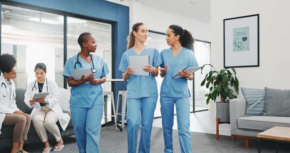 9-Tips-for-Post-Pandemic-Healthcare-Recruitment-talking-nurses-walking-hospital